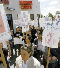 Demonstrators in Seattle march in front of a Marine Corps recruiting station on May 23 to protest the war in Iraq and military recruitment in schools.