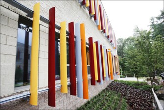 Brightly colored blinds hang outside of a first grade window at the new Sandy Hook Elementary School.