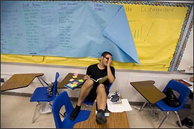 Academy @ Shawnee 10th grade English student Chris Heick laughs at a comment form a fellow student on May 31.