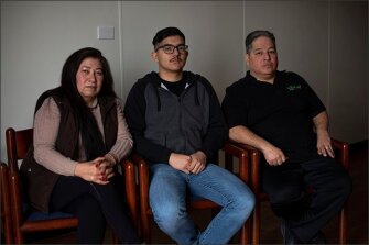 Mary Flores, left, and her husband Joel R. Flores, far right, were banned from the Victory Preparatory Academy campus after they wrote about the 2017 protest at the Denver-area high school for their Spanish-language newspaper, La Prensa de Colorado. Their son, Emilio, center, a graduating senior at the school, said it pained him when his parents couldn't attend his soccer games.