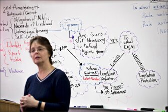 Kathy Durham, a West Wendover High School civics teacher, talks with students about crafting legislation around gun control during a U.S. Government class for seniors in West Wendover, Nev.