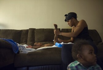 Kourtney Mills changes her daughter’s diaper. The Mills family was on a waiting list for five years before an apartment opened up for her family at Potomac Gardens. Many people who qualify for subsidized housing or rental assistance don’t receive it, and, in many cities, families wait longer than Mills did.