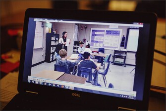 A video of Jordan McCarty teaching a class at Pine Mountain Middle School in Kennesaw, Ga. is paused while other teachers in her group provide feedback.