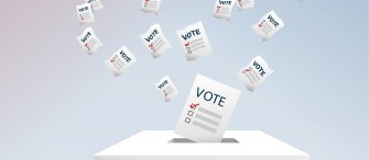 Image of ballots going into a box.