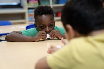 Kyro Sanchez, 7, participates in a science activity about pollinators during the East Providence Boys and Girls Club Summer Camp at Emma G. Whiteknact Elementary School on July 10, 2025, in Providence, R.I.