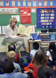 The education secretary reads to kindergartners at St. Mary’s Catholic School in Lincoln, Neb.