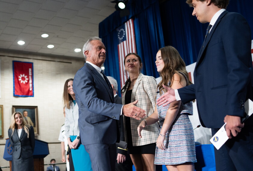 Robert F. Kennedy Jr., Secretary of Health and Human Services, shakes hands with the organizers of the event at the Hubert Humphrey Building in Washington on Sept. 1, 2026.