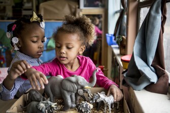 Lola Robertson, left, and Emily Outlaw play together during their preschool class at Starkville Early Learning Collaborative.