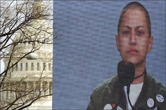 With the U.S. Capitol rising behind the stage, Marjory Stoneman Douglas High School student Emma González is seen on a giant video screen as she addresses the "March for Our Lives" rally in Washington.
