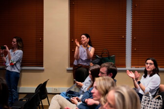 Attendees clap during a school board meeting at the Lower Merion School District Administration Building on May 11, 2026, in Ardmore, Pa.