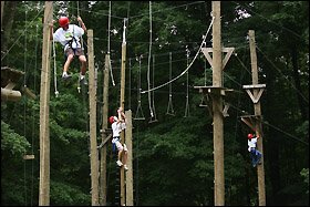 Students From Taylor Allderdice High School maneuver their way thorugh an aerial ropes course at Camp Guyasuta as part of the freshman orientation week.