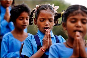 Young Indian children study at an open air school in Jammu, India.