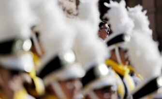 Lt. Gov. Dan Patrick is framed by the Elite College Prep Academy band as he speaks during a rally in support of school choice on the steps of the Texas Capitol on Jan. 24 in Austin, Texas.