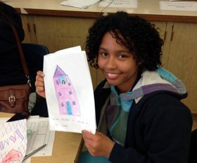 Dashara, a 10th grade student in Orphal's Intro to Education class, works on her children's book.