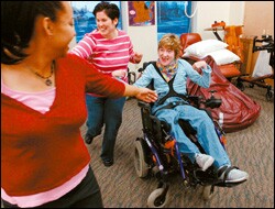 Patricia, a 12th grader dances in her wheelchair