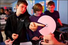 Carter Gillaspie, 14, examines a paper cone to be used in a stereo speaker that his group designed and built using 3-D printing technologies at Buford Middle School in Charlottesville, Va.