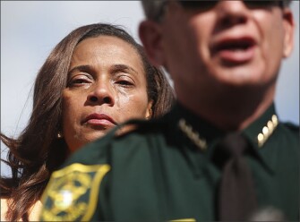 Tears run down the face of Broward County School Board member Rosalind Osgood as she listens to Broward County Sheriff Scott Israel speak during a news conference on Feb. 15, in Parkland, Fla.