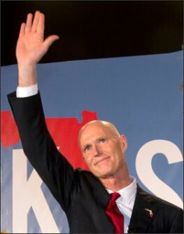 Florida Gov. Rick Scott waves to the crowd during a victory party on Nov. 4 in Bonita Springs, Fla., after defeating Democratic challenger and former Republican Charlie Crist.