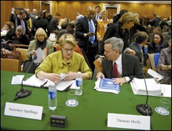 Secretary of Education Margaret Spellings confers with colleague Thomas Skelly.