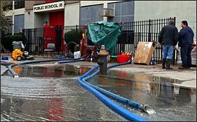 Water is pumped out of the Patrick F. Daly School in the Brooklyn borough of New York on Oct. 31, two days after Hurricane Sandy made landfall in New Jersey. The storm forced school closings from Florida to Maine last week and as far west as West Virginia and Ohio. But the 1.1 million New York City school system was especially hard hit, with schools closing for five straight days.