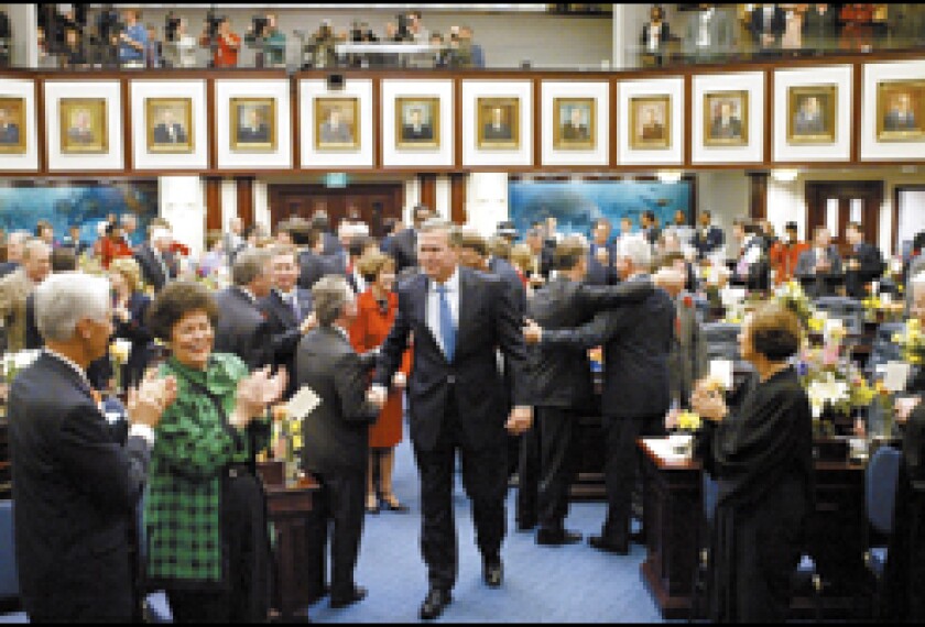 Gov. Jeb Bush of Florida enters the House chamber to deliver his State of the State Address to a joint session of the legislature on March 9 in Tallahassee. The session is slated to adjourn May 6.