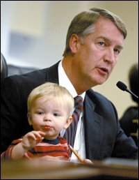 Utah Senate President John Valentine gets some help from his grandson Nicholas Carroll during the final session of the legislature on March 2