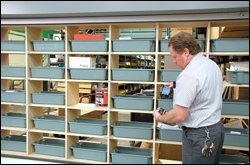 Phillip Tomas, an electrician with the Forsyth County, Ga., schools, takes inventory using a "personal digital assistant," or PDA.