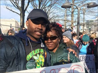 Ryan Olden, a senior at Great Mills High School in Great Mills, Md., stands with his mother, Kim Webb, before the start of the "March for Our Lives" in Washington on March 24. The school was the scene of a fatal shooting last week.