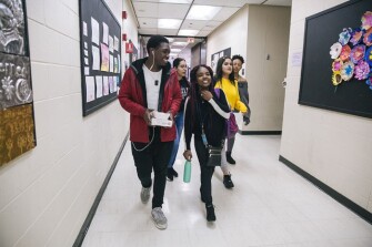 Junior Rochelle Borden, 17, (right) walks with her boyfriend, Archie Grant, 17, (left) to her art class at Whitney M. Young Magnet High School in Chicago. The pair have been dating for two years.