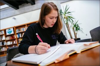 First-time voter Erin Mortensen, 18, studies calculus in a library at Utah State University in Logan, Utah. A self-described liberal Democrat, she said her high school did a good job of teaching civics, though she would’ve liked to spend more time learning debate skills.
