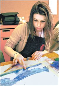 A Mount Ararat High School student tries the wet-on-wet technique used by William Thon.
