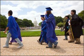 Supporters of the proposed DREAM Act march before the start of a mock graduation ceremony on June 23 in Washington.