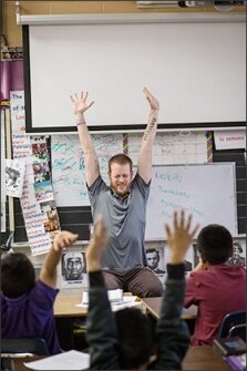 James Butler, the mindfulness director of the Austin Independent School District, leads 3rd graders in mindfulness exercises at the district’s Andrews Elementary School.