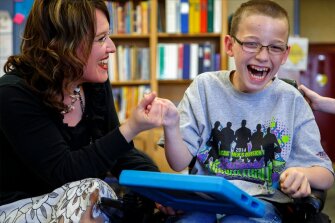 Special education teacher Greta Smith works with a student during class at Buhler Grade School in Buhler, Kan. Students at the school were among those field-testing assessments aligned with the Common Core State Standards and designed for those with cognitive disabilities.