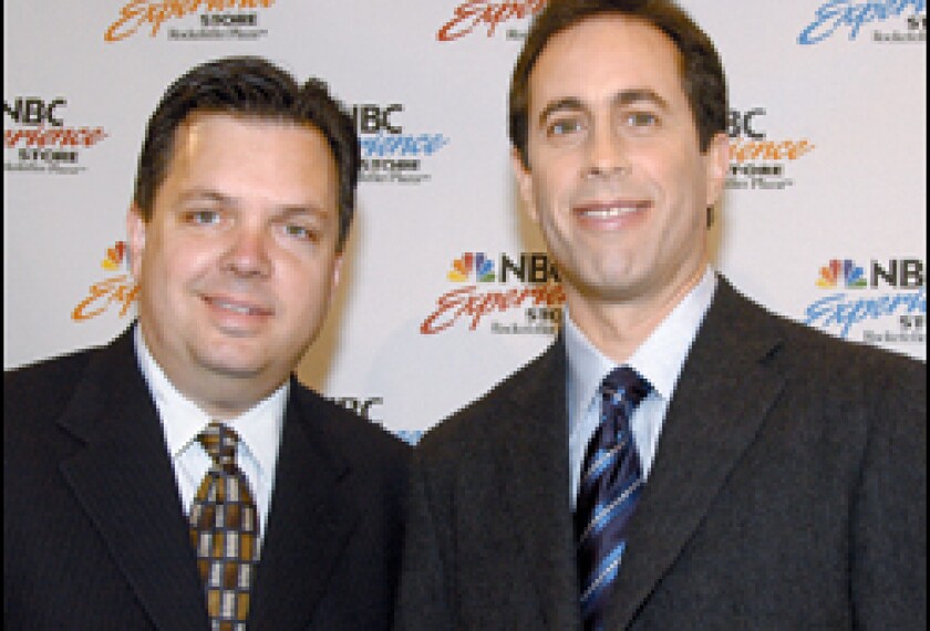 Kevin F. Sullivan, left, with the comedian Jerry Seinfeld last year. The former NBC PR executive is now the assistant secretary for communications and outreach.