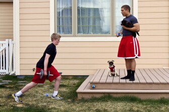 Mr. Davis leads his girlfriend's younger brother, Colin Wagner, through cardio- and weight-training exercises.