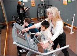 Pam Skogstad helps 7th grader Michael
