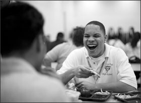 Alamin shares a laugh over lunch in the school’s cafeteria.