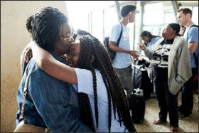 Raziya Wells bids farewell to her daughter Kaiya Burnett, 17, a student at Ballou High School, as high school students from across Washington gather at Dulles International Airport for a study abroad trip to Argentina.