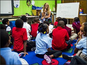 Second-grade teacher Charline Beccia prepares her students for a writing exercise at Pierce Elementary School in Flint Mich. Because it is a smaller district, Flint stands to benefit from a proposed change to Title I funding that favors districts educating relatively high concentrations of low-income students, even though they may have relatively small enrollments.