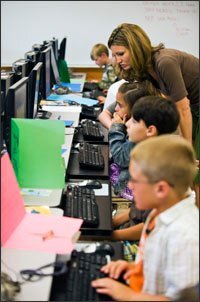 Students set up computer login and password information during the first week of school at Paine Primary School.