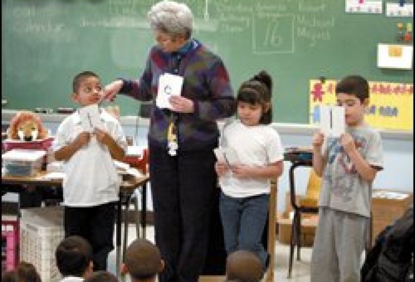 Barbara Healy, who is board certified, teaches spelling to her kindergartners at Stowe Academy in Chicago. A fraction of the city's teachers hold the credential.