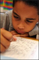 Devon Reid, a 3rd grader at New Holland Core Knowledge Academy, writes a composition about the human body’s circulatory system. Core Knowledge schools eschew the back-to-basics approach to learning.