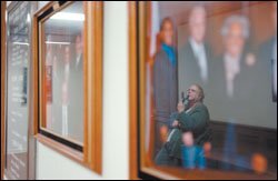ON THE HUNT: Jayne Carson, the head of the Helping Families team, waits for an elevator outside the Mobile County superintendent's office. She was tracking down the name of a boy whom a Mobile police officer asked her to check on. She visited with school officials to identify him and get a copy of his school records.
