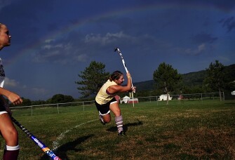 Stephanie Dressler takes a shot during field hockey practice at East Juniata High School. The 3,100-student Juniata district, in central Pennsylvania, has started charging student-athletes $250 per sport to participate this year to help offset budget cuts. With stimulus funds evaporating and states reducing education aid, districts are struggling to do more with less.