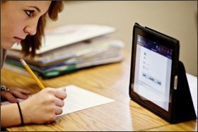 Students at Amelia Earhart Middle School in Riverside, Calif., are using iPads to read digital textbooks. The Riverside district was the first school system in the state to adopt and implement e-textbooks.