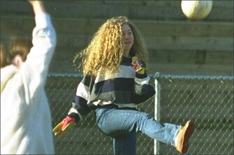 Chelsea Clinton, the then-12-year-old daughter of President Bill Clinton, clears the ball after making a save in goal during a soccer game at Sidwell Friends School, which she attended while her family was in the White House.