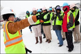 Lisa Anders, senior project manager for the Martin Luther King, Jr. National Memorial, leads a tour of the memorial construction site.