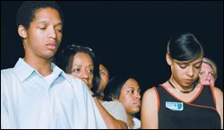 Disappointment registers on the faces of former Cleveland student Lawrence White, left, Cleveland schools’ chief Barbara Byrd-Bennett, and another Cleveland high school graduate, Sierra Roberts, front right, during the announcement that the school tax levy failed.