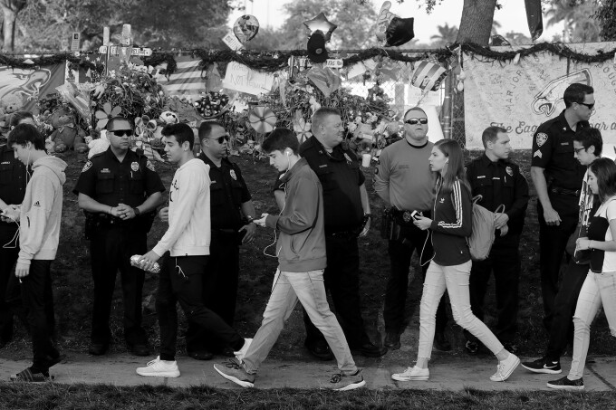 Students return to Marjory Stoneman Douglas High School for the first time after the mass shooting that killed 17 classmates and staff members.